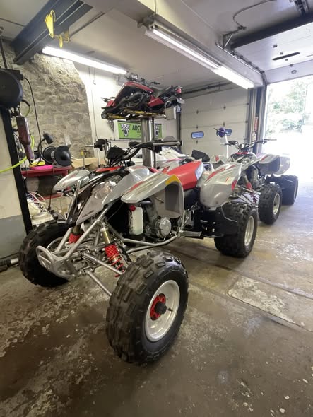 ATVs inside a service bay at Lake Hopatcong Motorsports